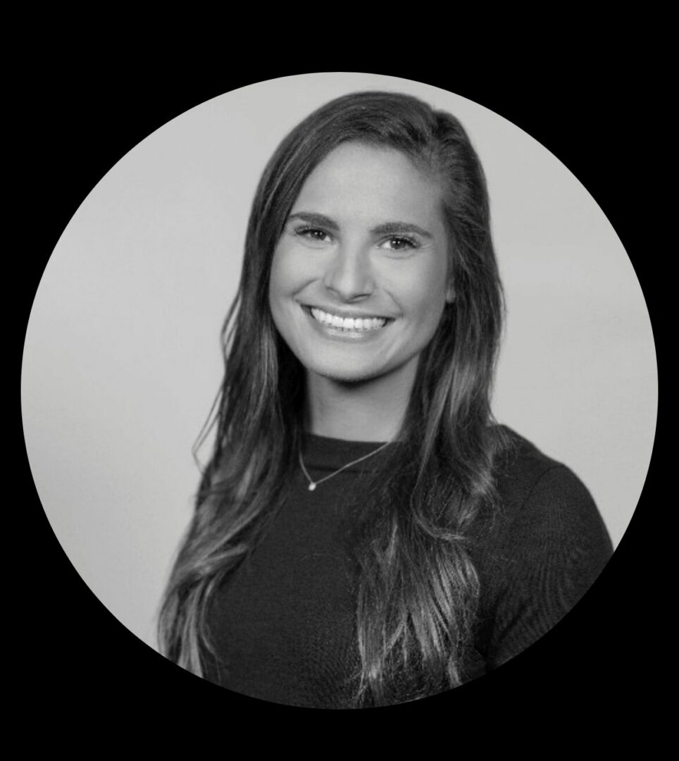 Smiling woman headshot, black and white.